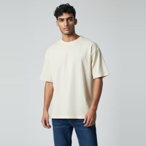 Model wearing cream plain t-shirt, colour code #F3E9D2 – Bulk Cloth Store